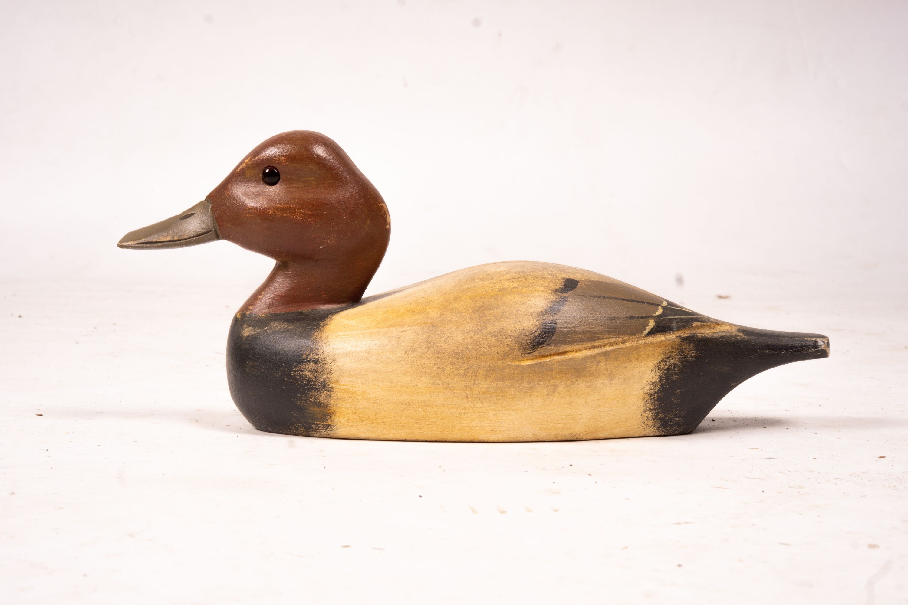 Three American carved and painted decoy duck ornaments, largest 48cm long